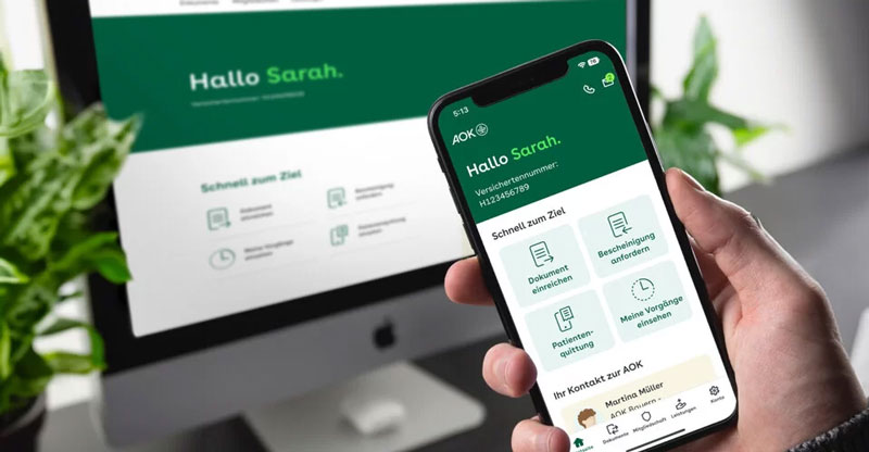 Krankenkassenwechsel lohnt sich: PC- und Smartphone-Bildschirm mit AOK-Seite.